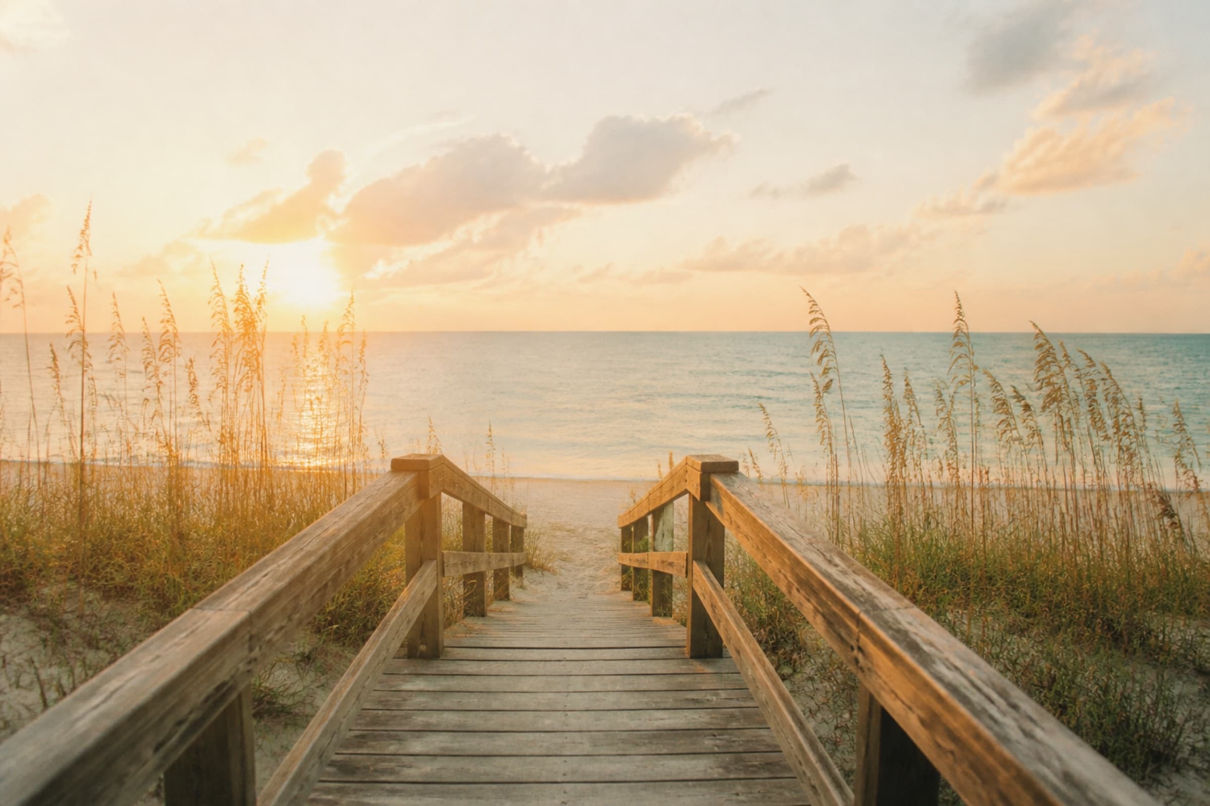 Boardwalk through sea oats toward the Gulf